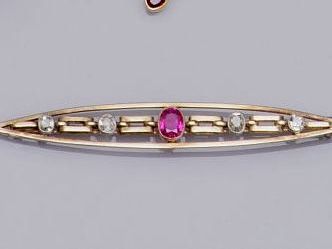 A ruby and diamond set bar brooch