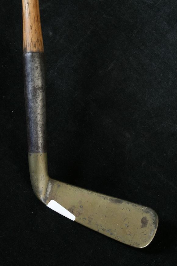Bonhams : An Army & Navy patented steel socket putter with curved head,