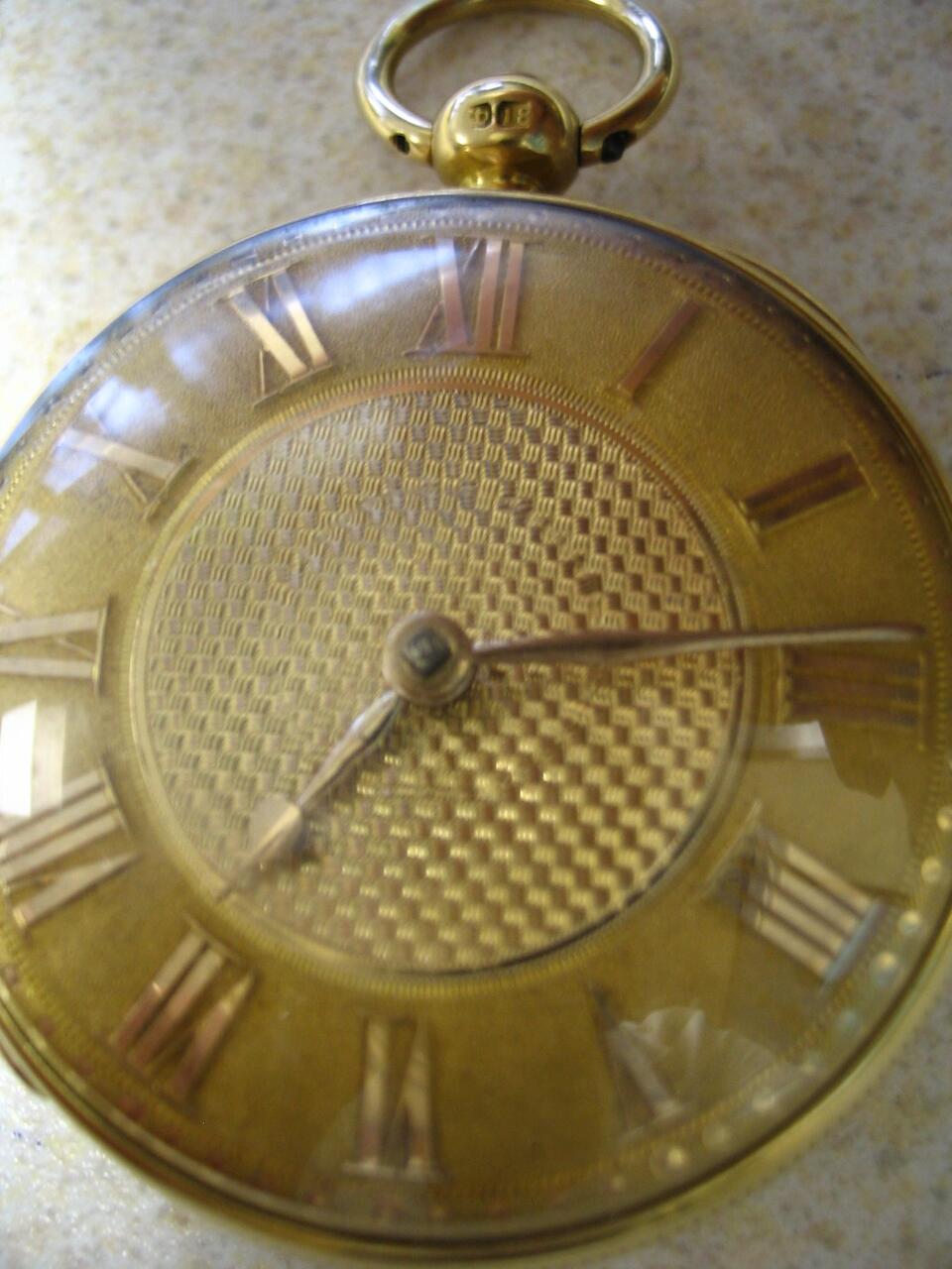 Bonhams Dutton, London An 18ct gold key wind pocket watch