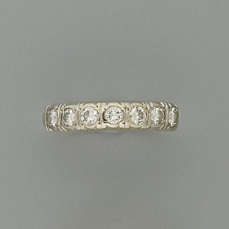A diamond half hoop ring