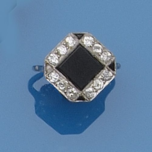 A diamond and onyx panel ring