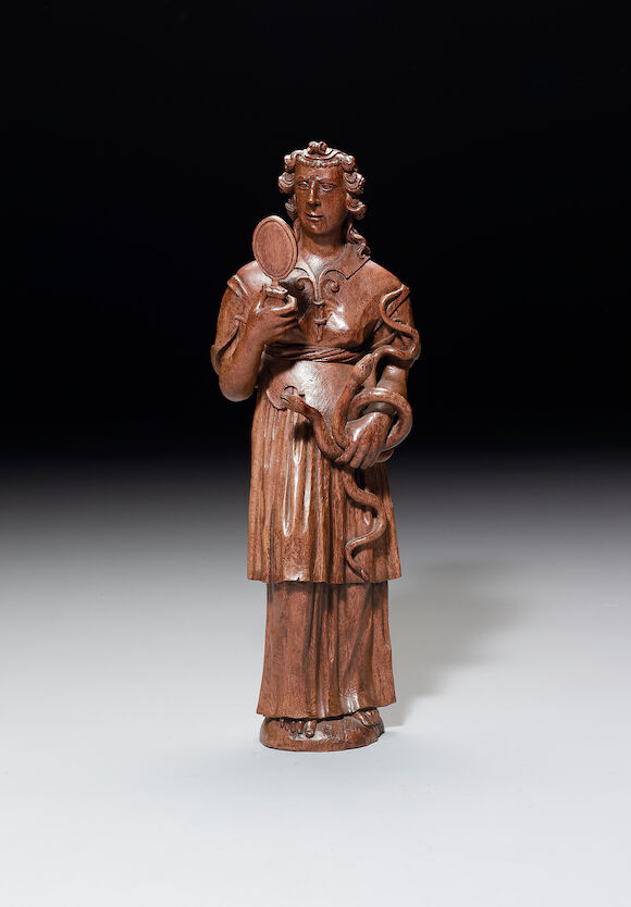 Bonhams : A late 16th century French/ Flemish carved oak figure of Prudence