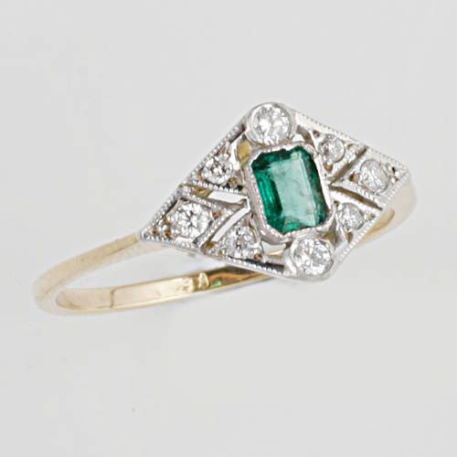 A diamond and emerald ring