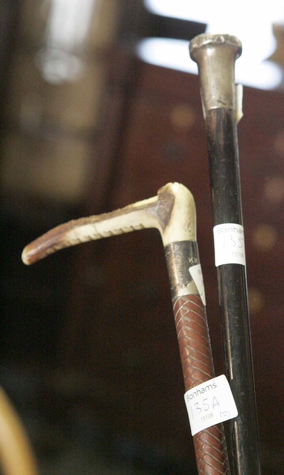 Bonhams : A silver topped walking stick together with a bone handled ...