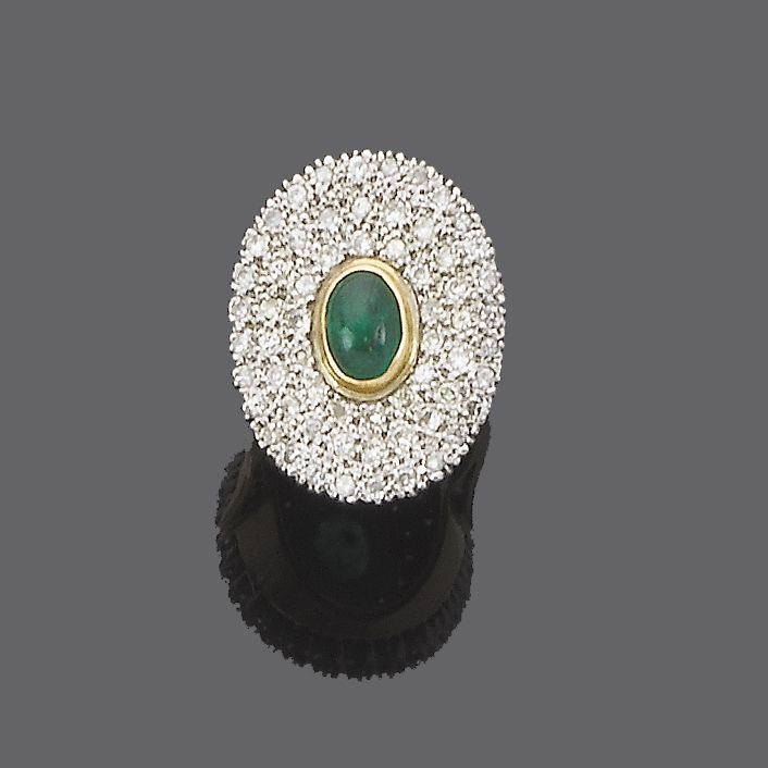 A diamond and emerald cluster ring