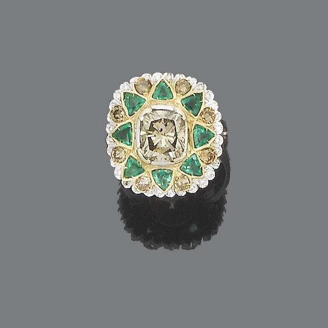 A diamond and emerald cluster ring