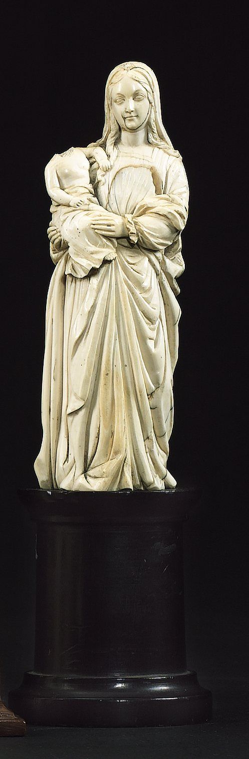 Bonhams : A carved ivory figural group of the Madonna and Child