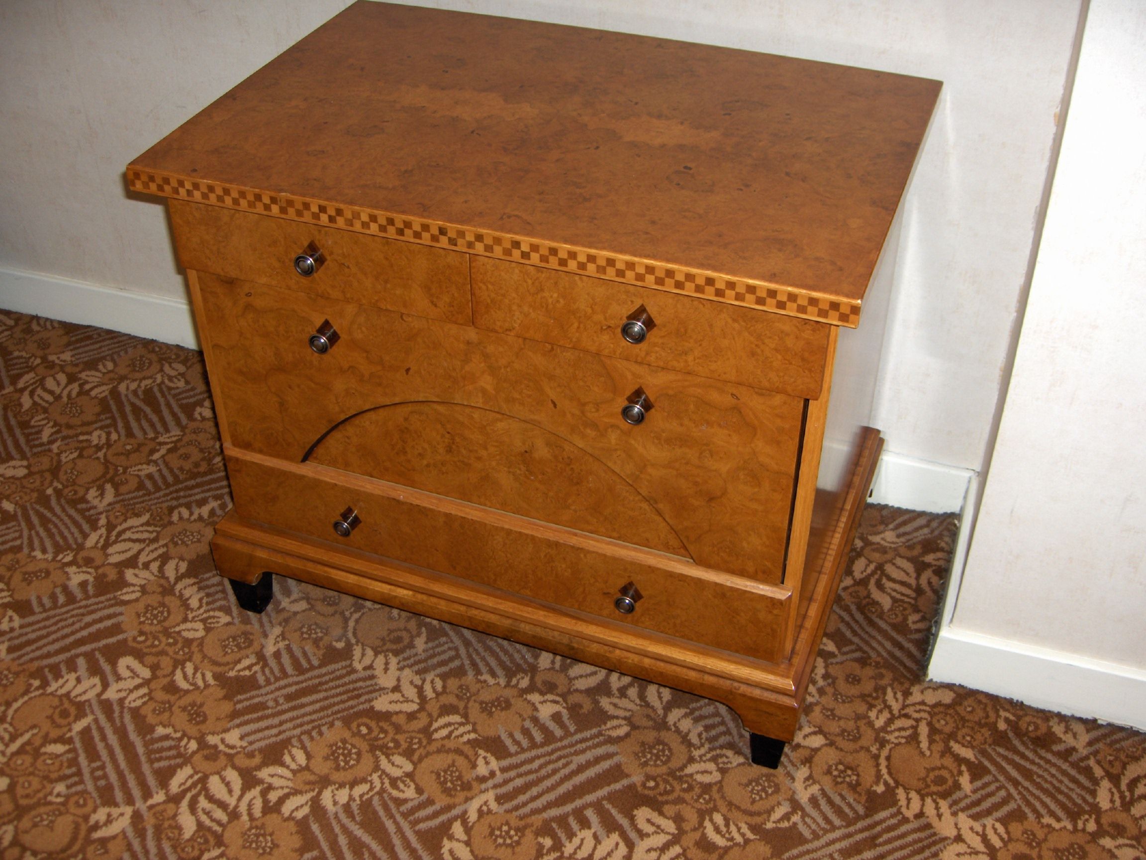 A small Biedermeier style walnut commode