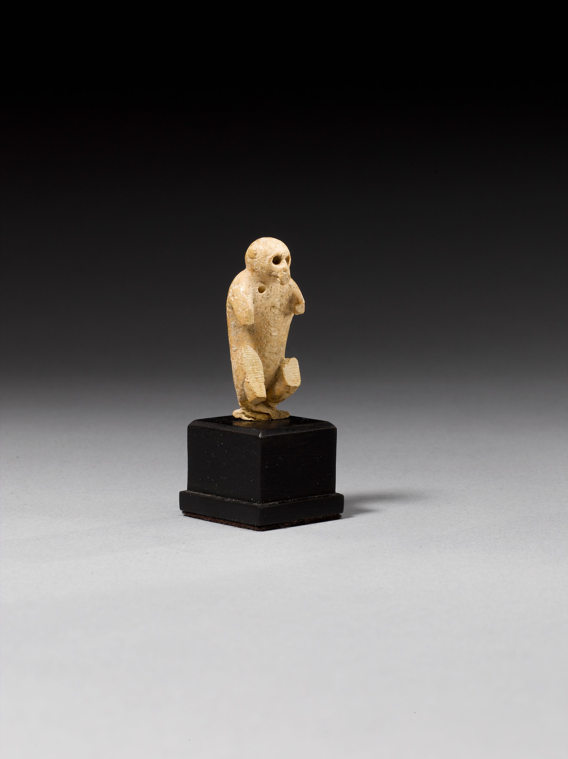 A bone monkey finial or amulet