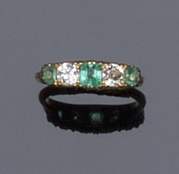 A five stone emerald and diamond ring