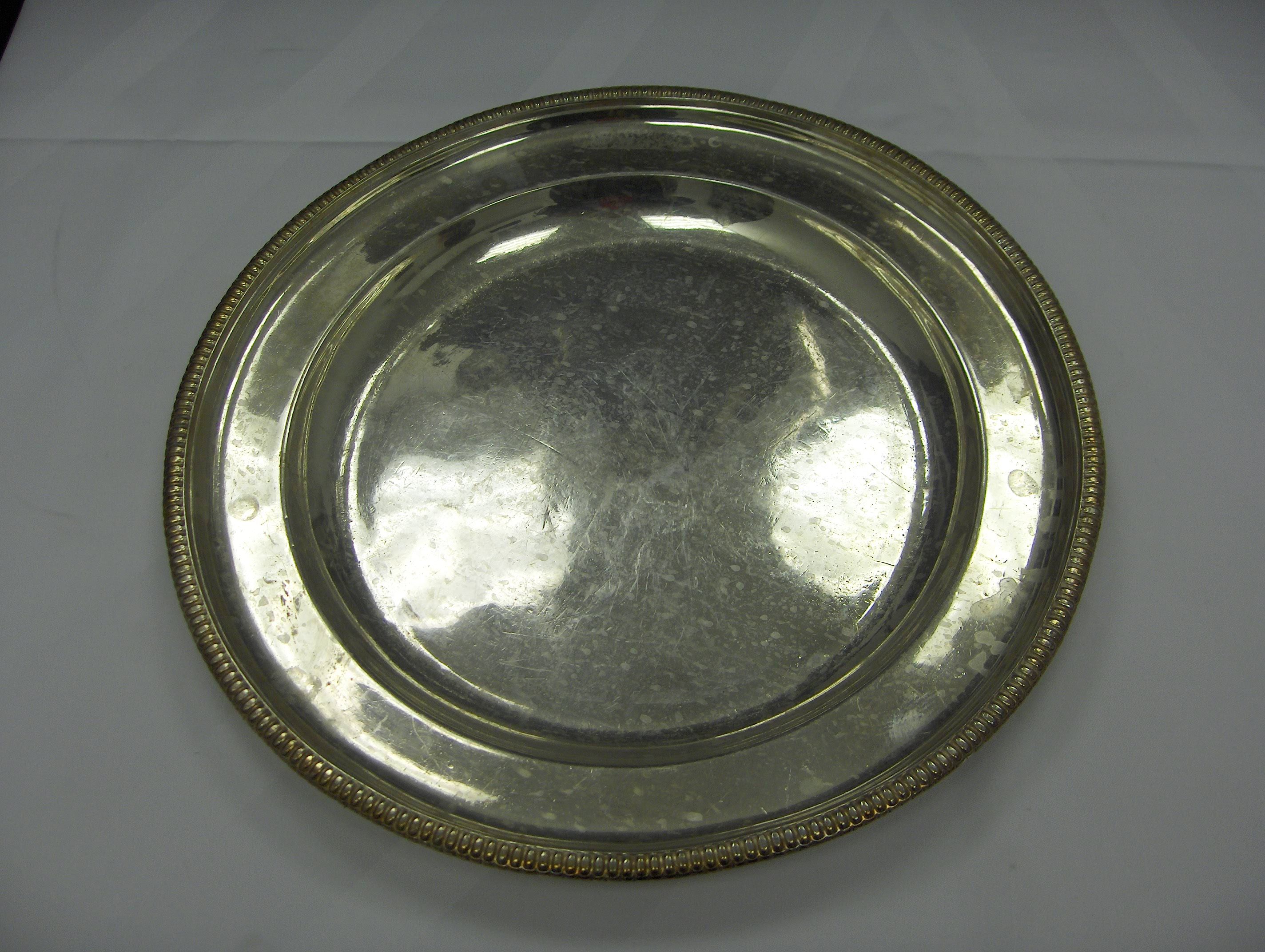Five large silver plated circular trays