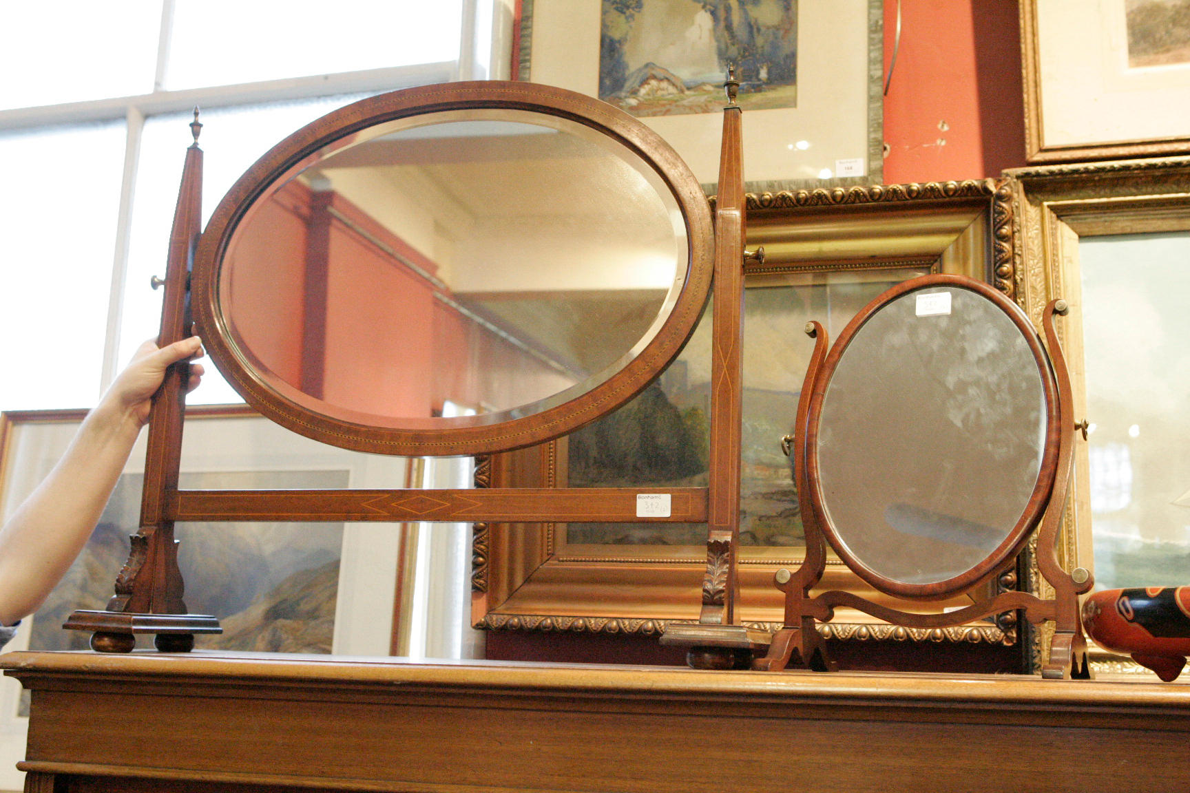 An Edwardian mahogany and inlaid dressing table mirror, together with a...