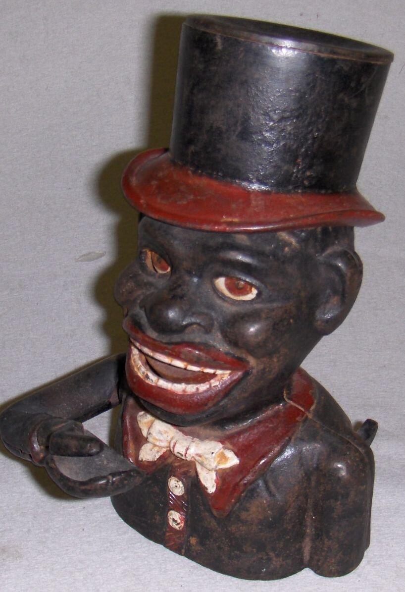 Bonhams A cast iron "Jolly Nigger Bank",