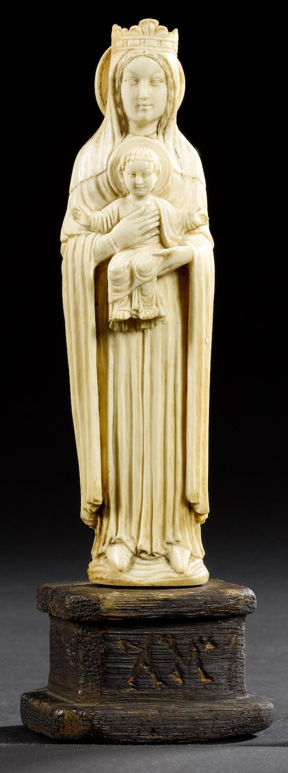 Bonhams : A 19th century carved ivory figural group of the Madonna and ...