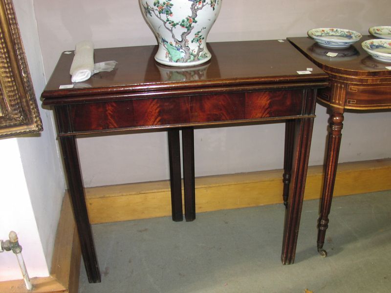 A George III mahogany rectangular fold-over tea table,