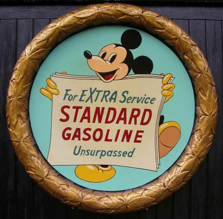 A raised laurel leaf framed, 'Standard gasoline' advertising plaque,