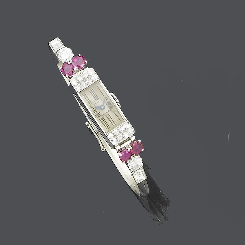A diamond and ruby cocktail watch,