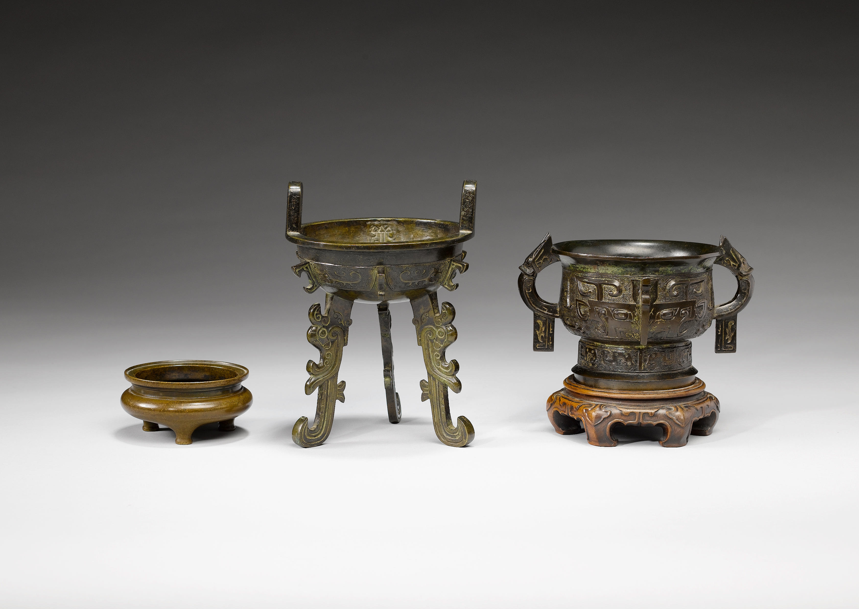 Three bronze archaistic vessels
