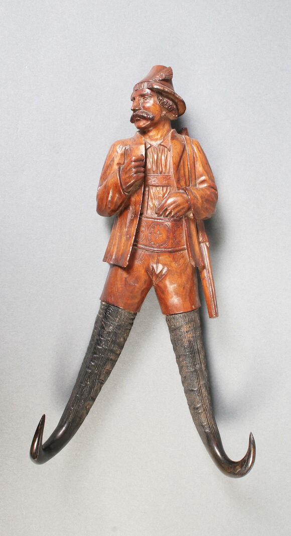 Bonhams : A Black Forest walnut wall mounting coat hook, late 19th century