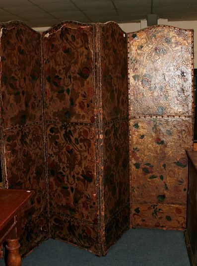 A large four leaf leather screen