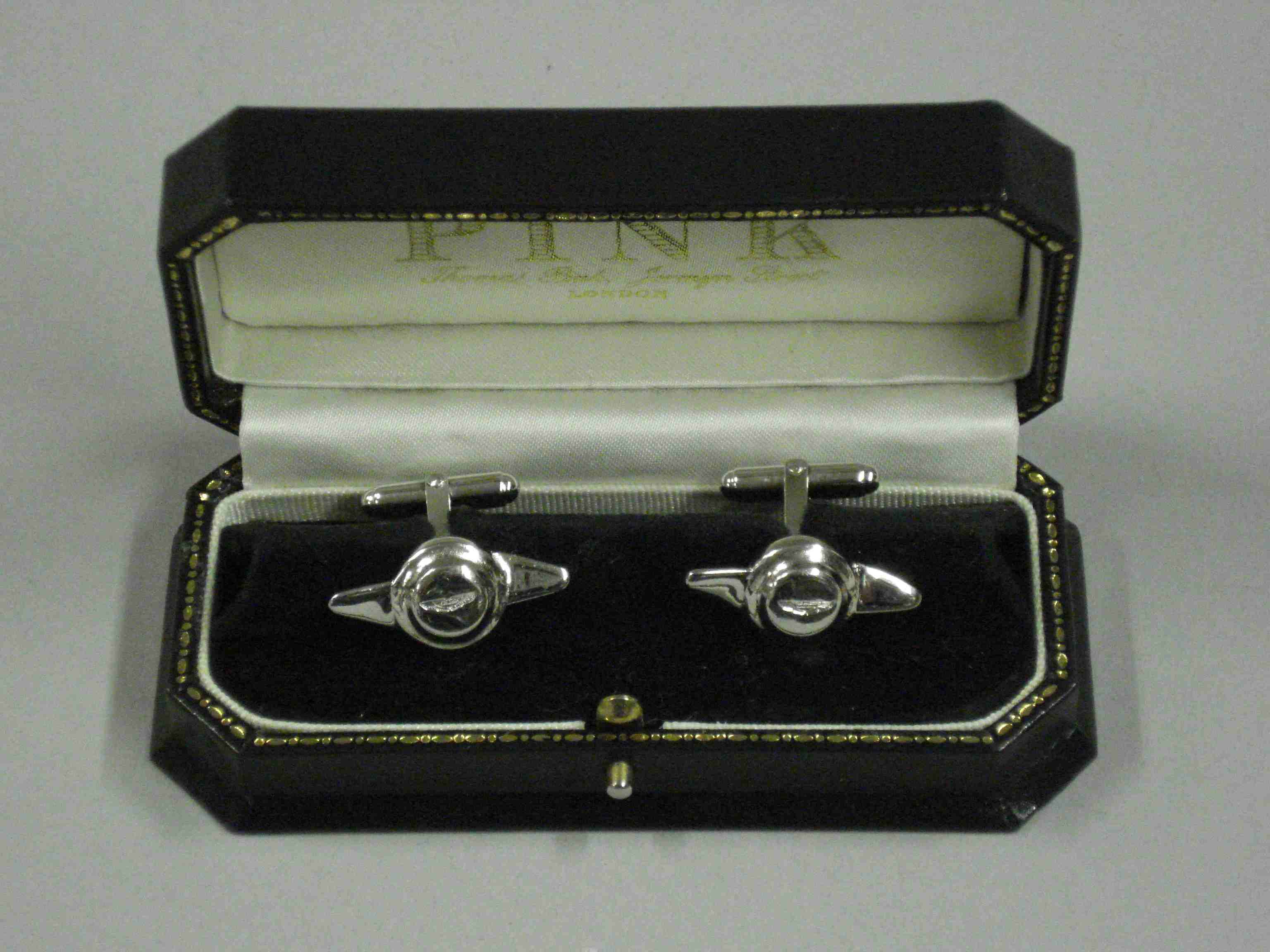 Bonhams Cars a pair of silver Aston Martin hubcap shaped cufflinks,