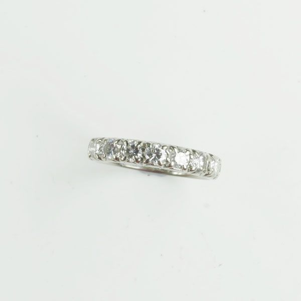 A diamond half hoop ring
