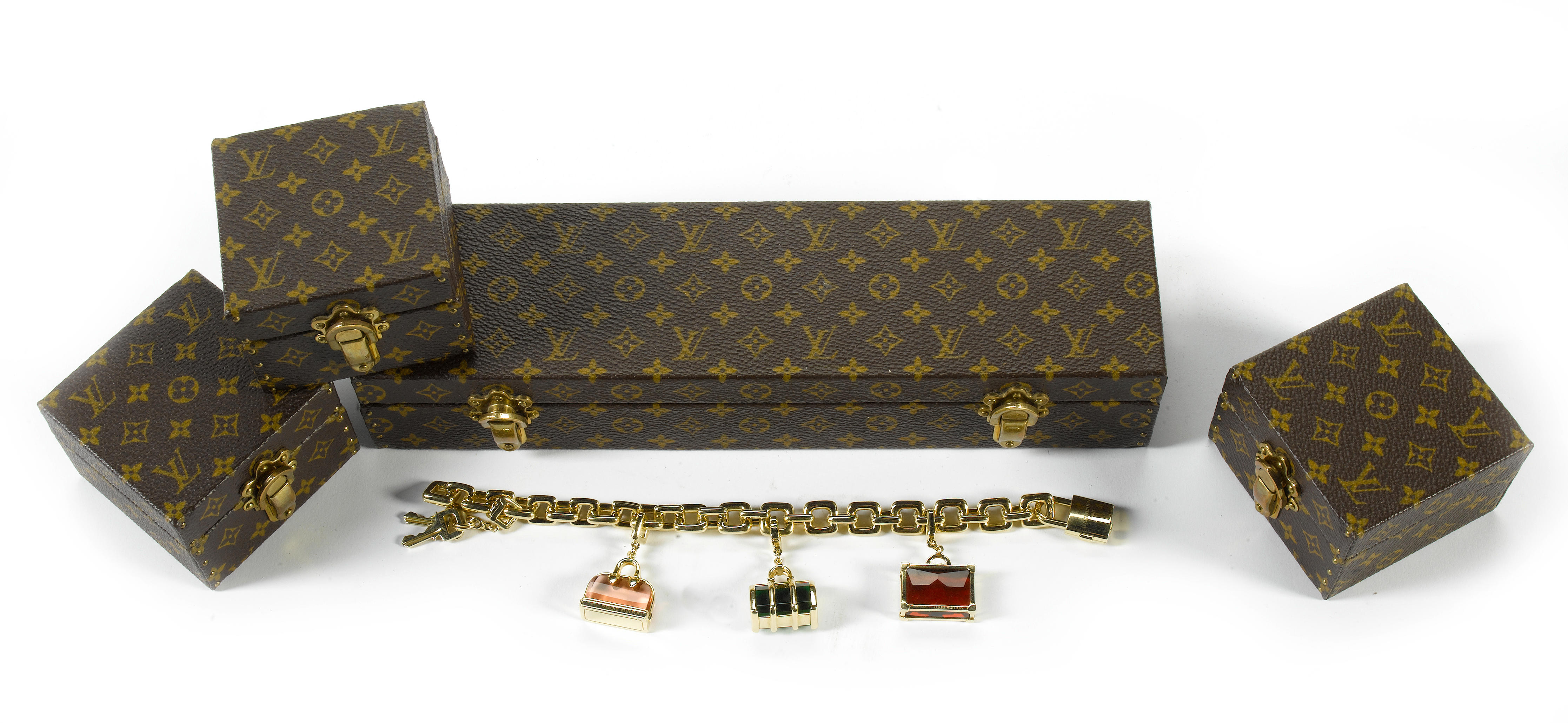 Louis Vuitton - a fine ladies 18 ct gold charm bracelet,