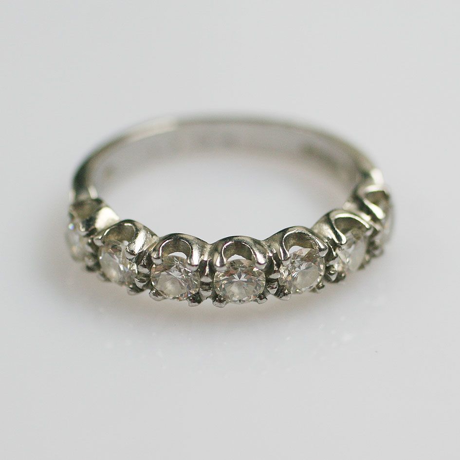 A diamond half hoop ring