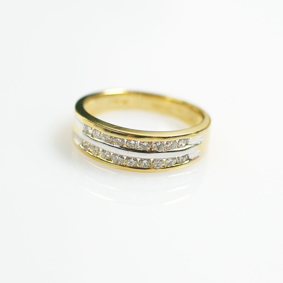 A diamond half hoop ring