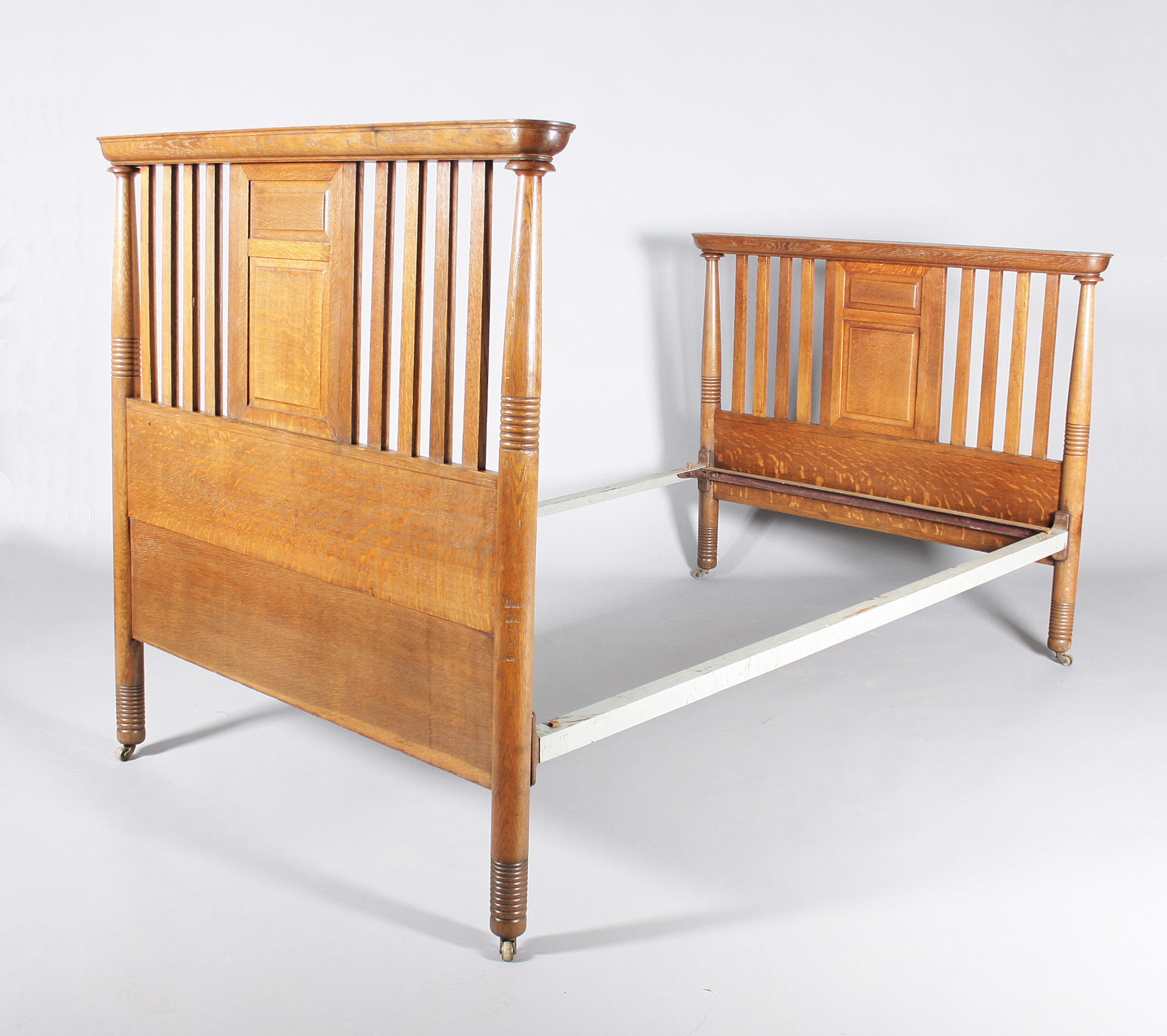 An oak double bed, probably by William Birch, circa 1900