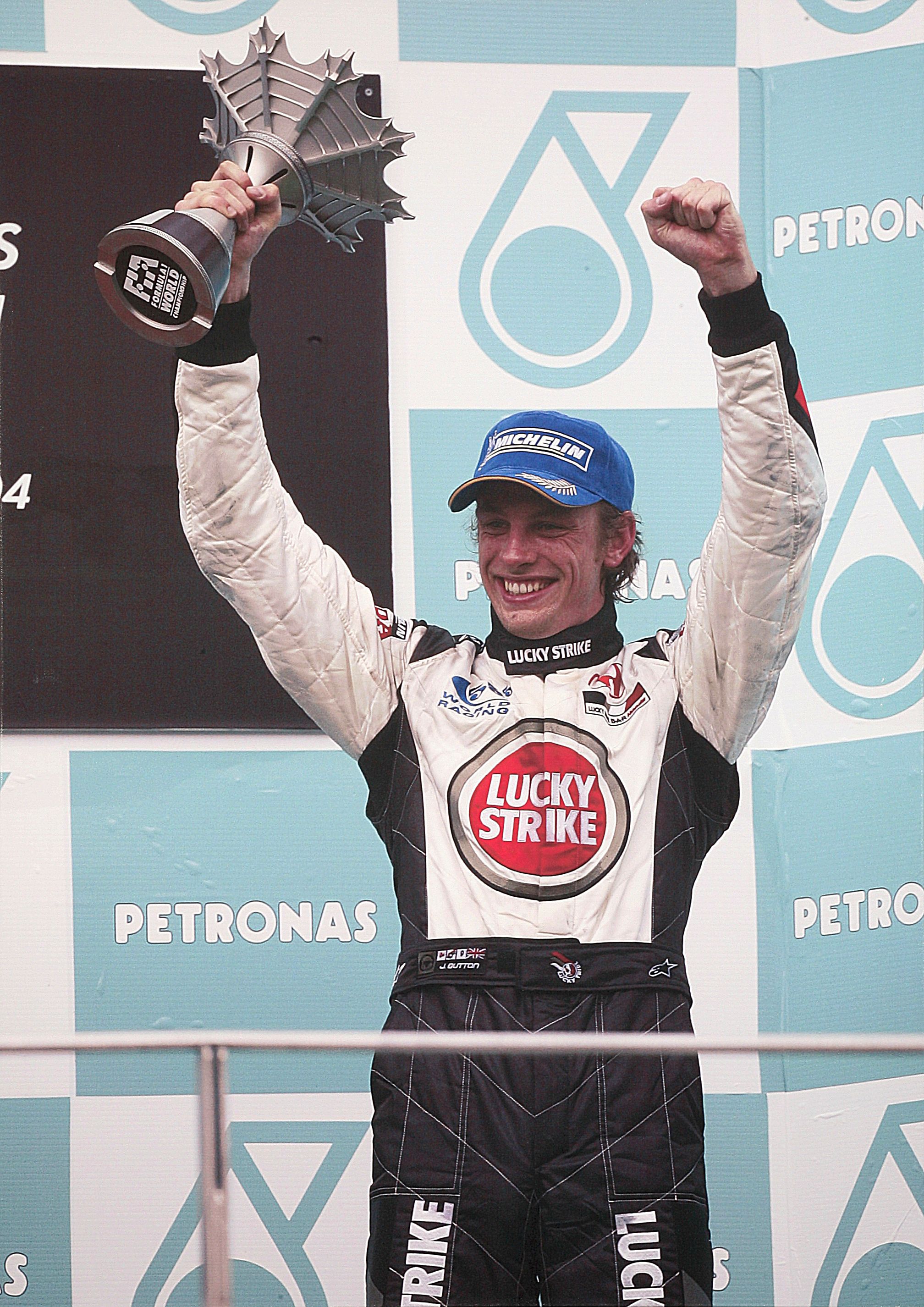 Bonhams Cars A large photoprint depicting Jenson Button on the