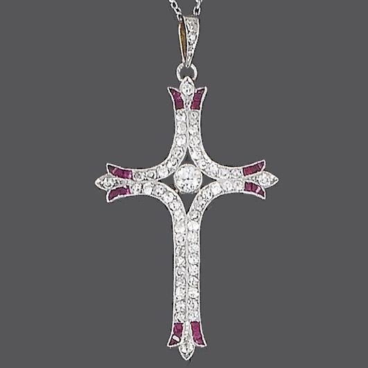A ruby and diamond cross pendant,