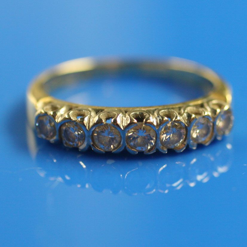 A diamond half hoop ring