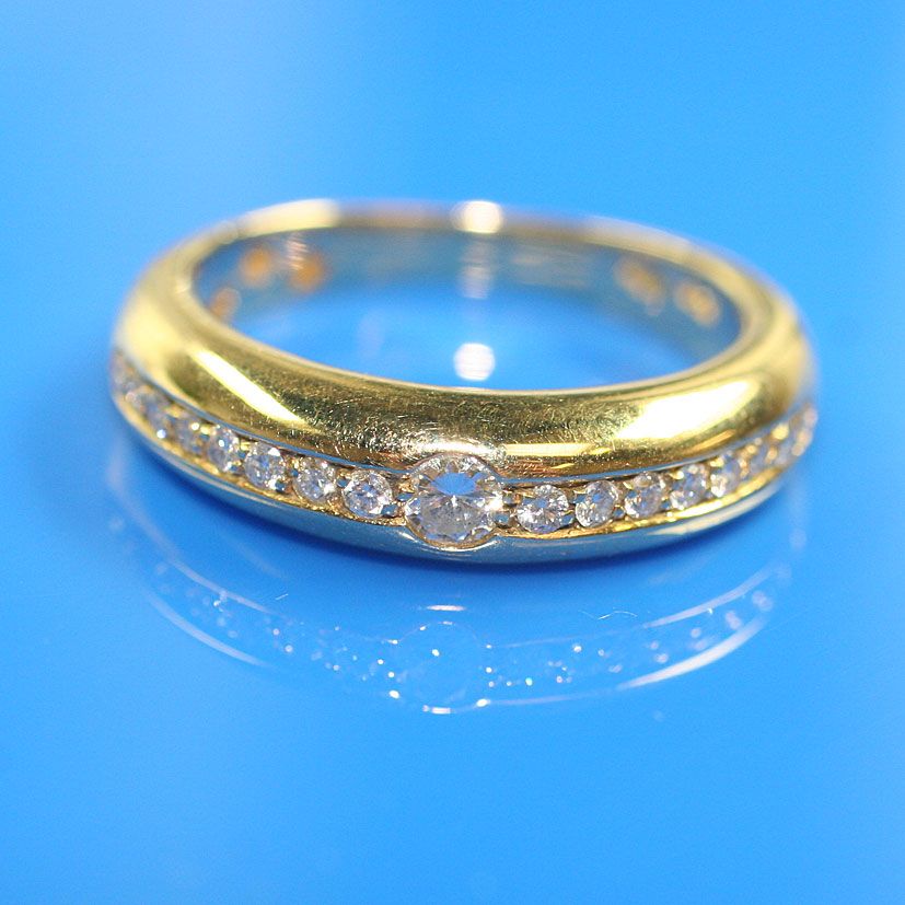 A diamond half hoop ring