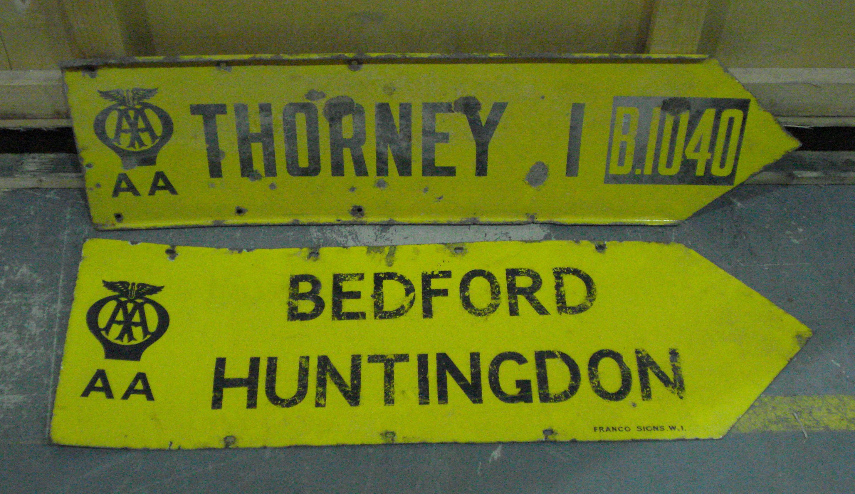 Bonhams Cars : Two AA directional route marker enamel signs,