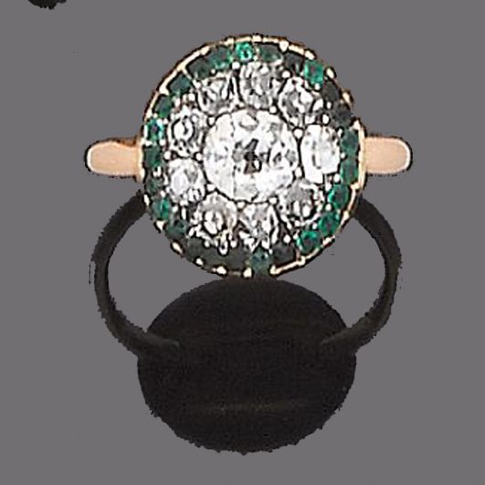 An emerald and diamond ring,