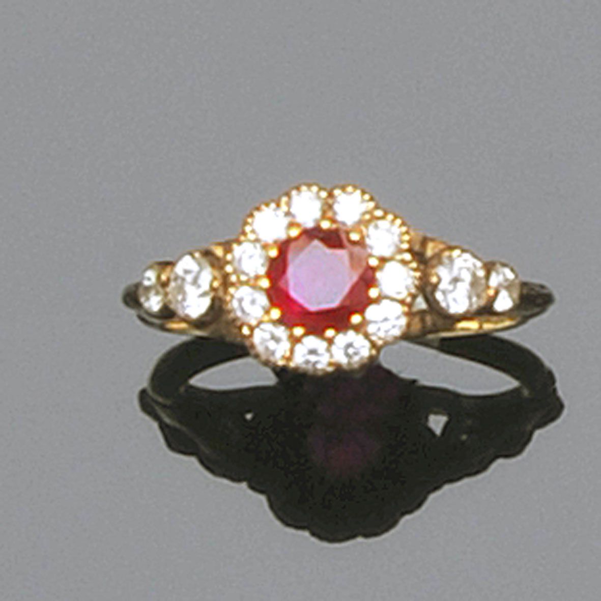 A ruby and diamond cluster ring