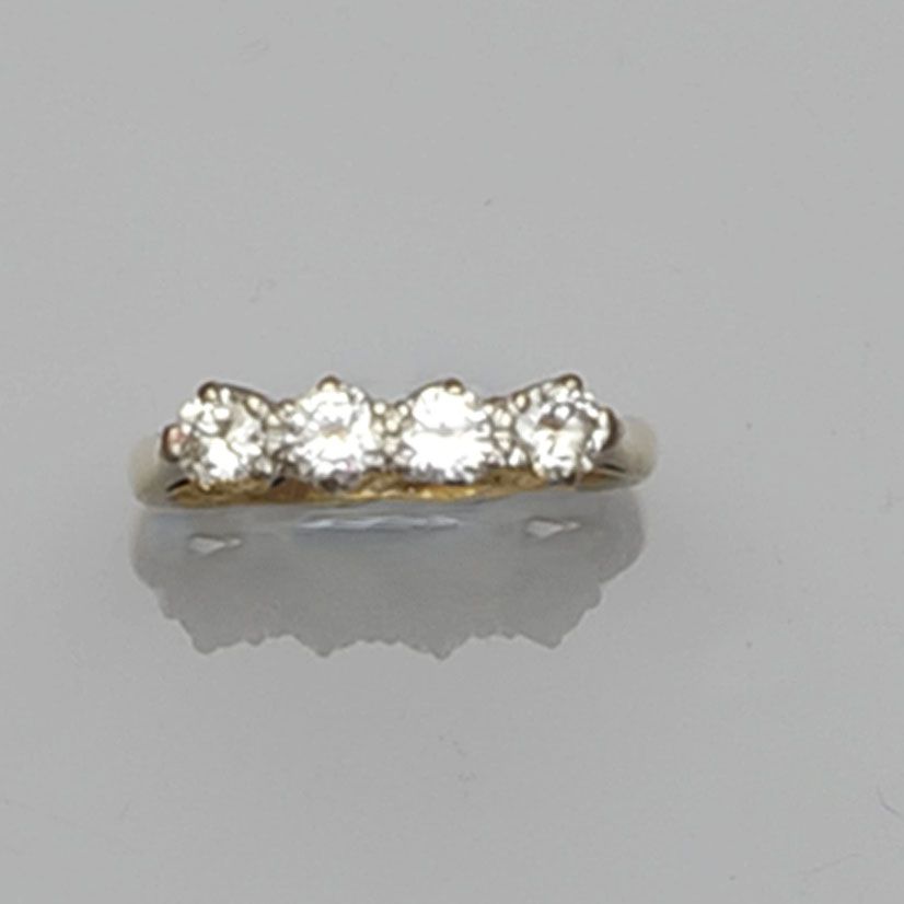 A diamond four stone ring