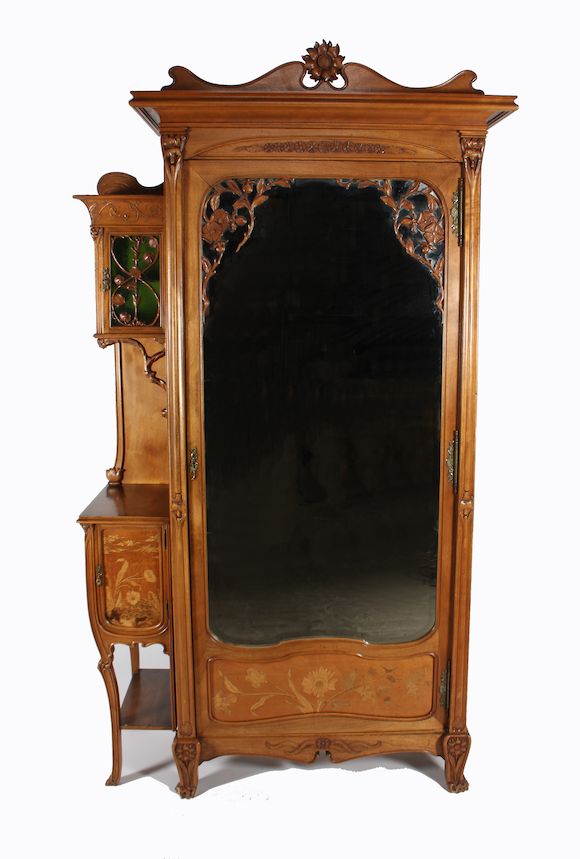Bonhams : A good French Art Nouveau carved and inlaid walnut four