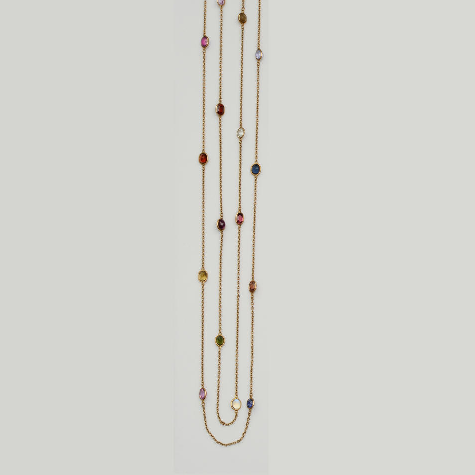 A long multi gem set necklace