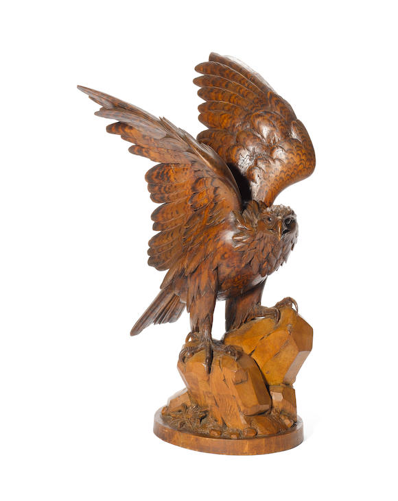 Bonhams : An early 20th century Black Forest carved and stained wood eagle