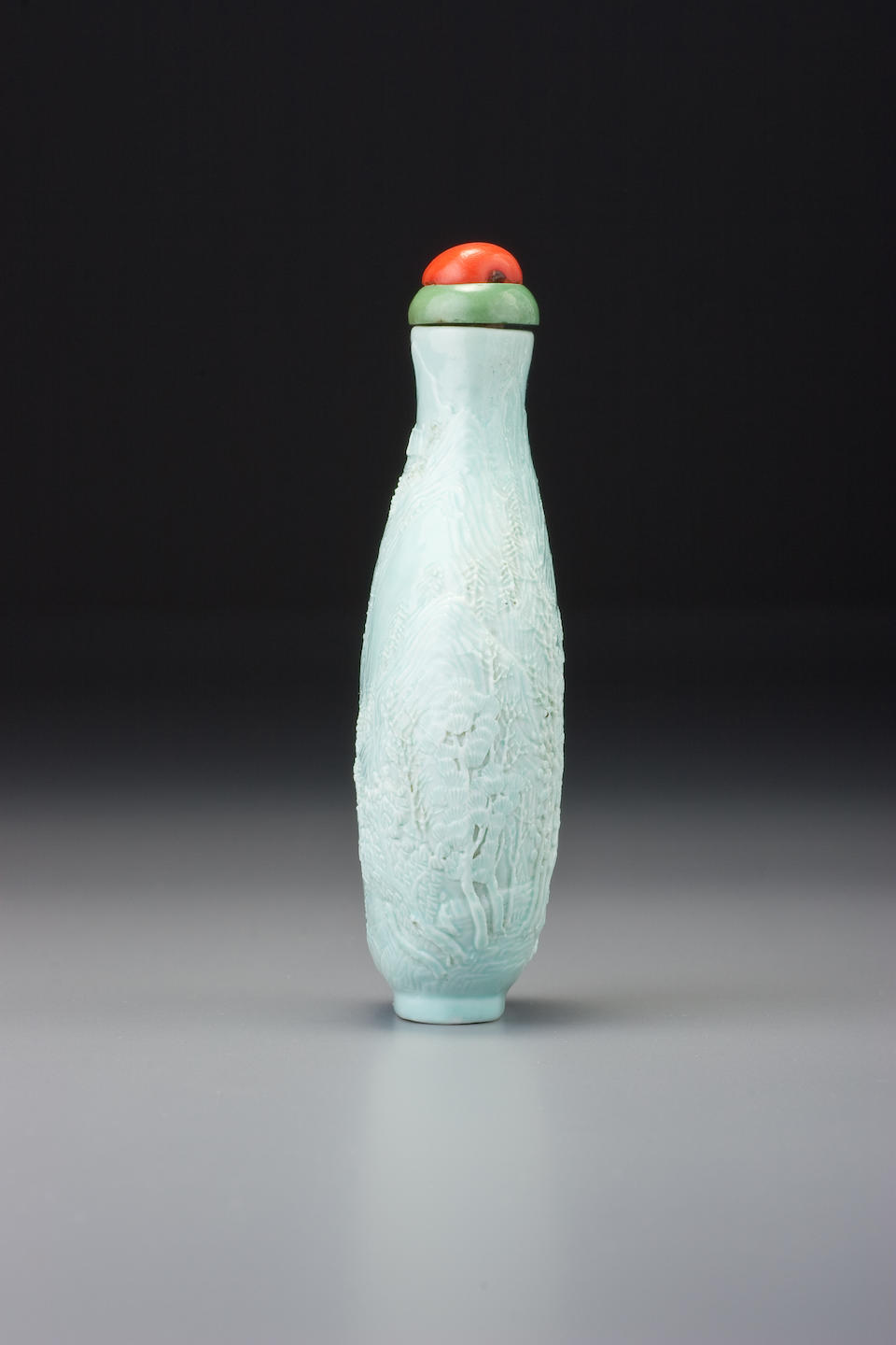 Bonhams : A pale turquoise porcelain carved 'landscape' snuff bottle ...