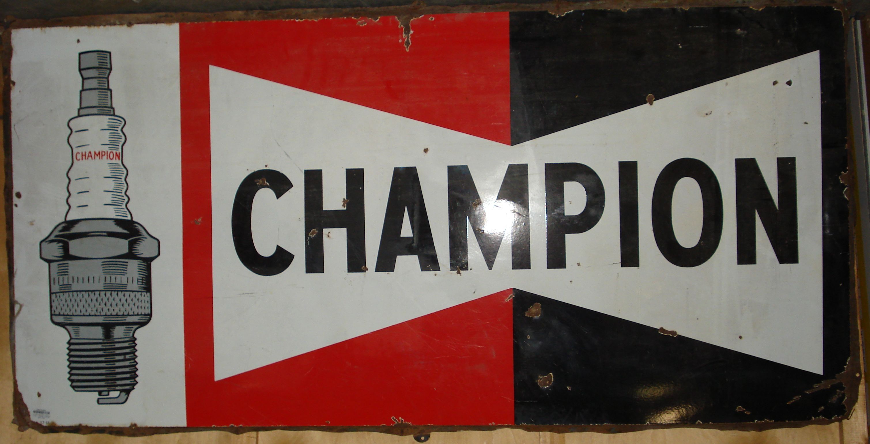 Bonhams Cars : A Champion Sparkplugs enamel sign,