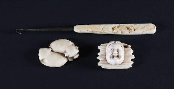 Bonhams : A Japanese carved ivory netsuke mask, another of two dogs and ...