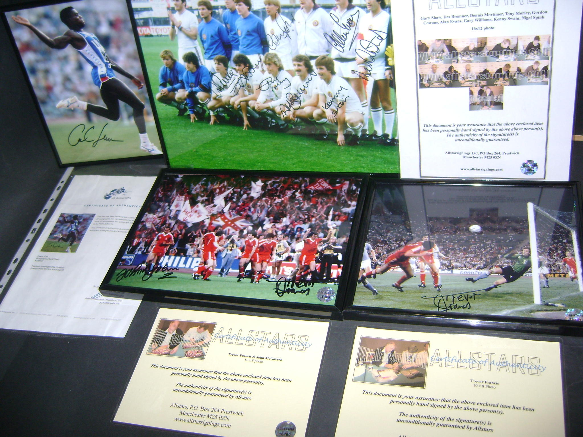A collection of hand signed framed pictures