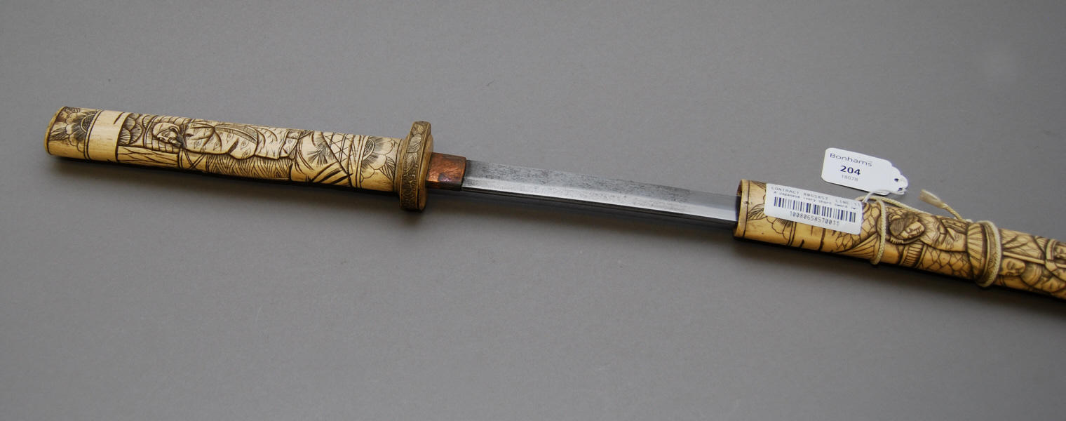 A Japanese ivory short sword (wakisashi)