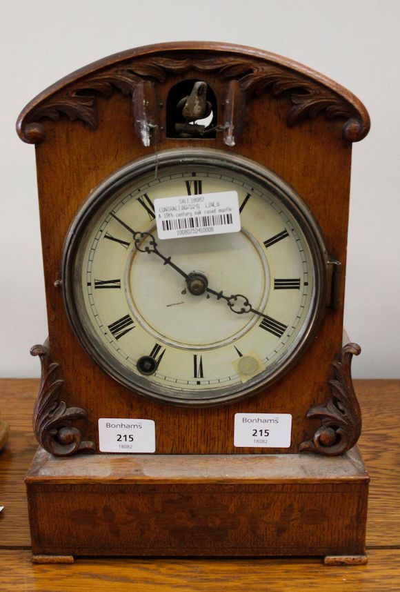 Bonhams A 19th century oak cased mantle cuckoo clock