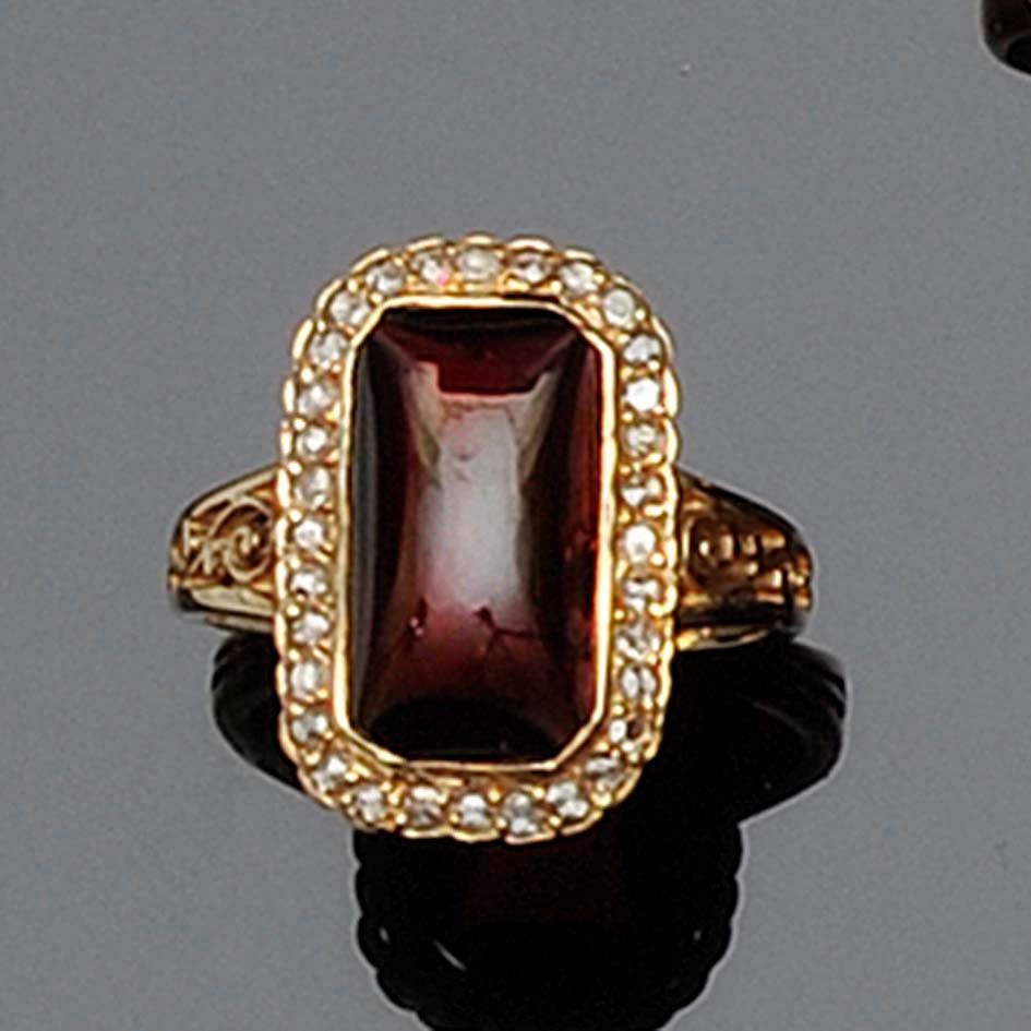 A garnet and diamond cluster ring