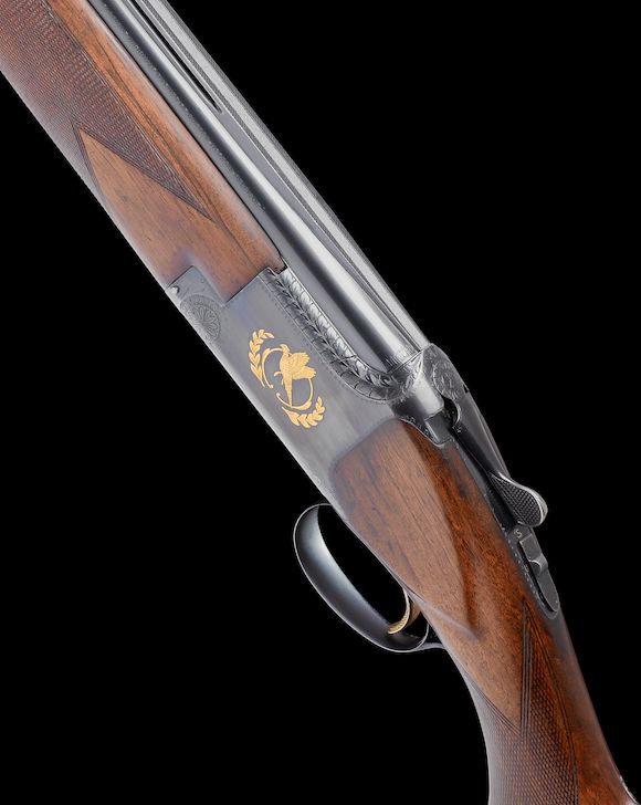 Bonhams : A J.M. Debrus-engraved 12-bore (2¾in) single-trigger over-and ...