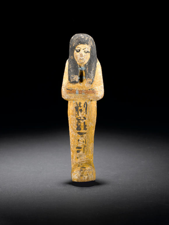 Bonhams : An Egyptian polychrome wood shabti